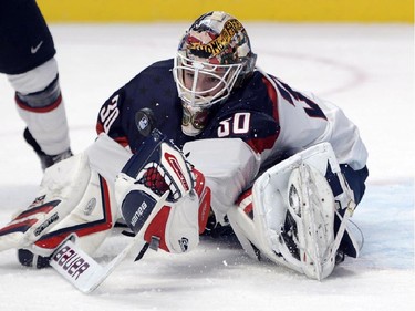 USA's goaltender Thatcher Demko makes a save during first period preliminary round hockey action against Canada at the IIHF World Junior Championship Wednesday, December 31, 2014 in Montreal.THE CANADIAN PRESS/Ryan Remiorz
