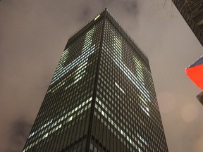 The CIBC building in downtown Montreal has offices lit up to show the number 4 on all four sides on Saturday, Dec. 6, 2014.