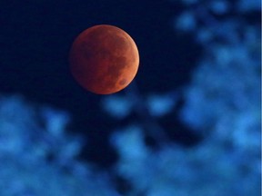 The world looks so benign when seen from afar. Even when the Earth's shadow is cast over the moon during a total lunar eclipse, creating what is known as a "blood moon."