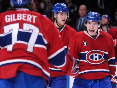 Brendan Gallagher (#11) of the Montreal Canadiens celebrates his second period goal with teammates during the NHL game against the Vancouver Canucks at the Bell Centre on December 9, 2014 in Montreal, Quebec, Canada.