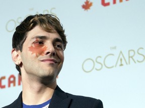 Xavier Dolan, director of the film 'Mommy", speaks to the media at a news conference Friday, September 19, 2014 in Montreal.