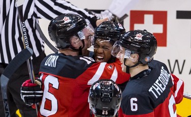 Max Domi (#16), Darnell Nurse (#25),  Shea Theodore (#6) and Anthony Duclair (#10) of Canada celebrate a goal against Russia during the Gold medal game of the 2015 IIHF World Junior Championship on January 05, 2015 at the Air Canada Centre in Toronto, Ontario, Canada.