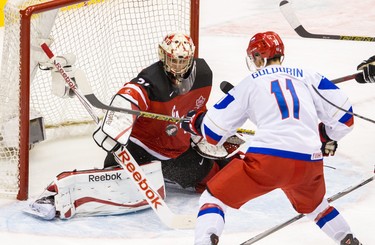 Zach Fucale (#31) of Canada makes a huge save against Nikolai Goldobin (#11) of Russia during the Gold medal game of the 2015 IIHF World Junior Championship on January 05, 2015 at the Air Canada Centre in Toronto.