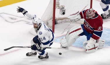 Tampa Bay Lightning's Brett Connolly celebrates after scoring past Montreal Canadiens goalie Carey Price during second period NHL hockey action Tuesday, January 6, 2015 in Montreal. THE CANADIAN PRESS/Paul Chiasson