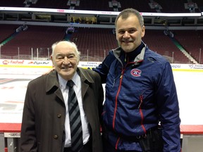 Former Canadiens goaltender Charlie Hodge, 81, with Habs' assistant athletic therapist Nick Addey-Jibb, on the team bench in Vancouver's Rogers Arena on Oct. 30, 2014.