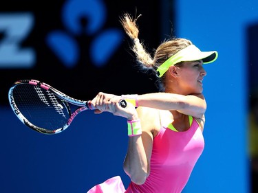 Eugenie Bouchard of Canada plays a backhand in her third round match against Caroline Garcia of France during day five of the 2015 Australian Open at Melbourne Park on January 23, 2015 in Melbourne, Australia.
