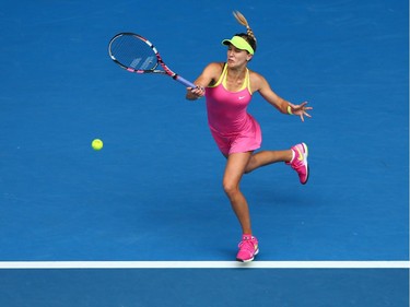MELBOURNE, AUSTRALIA - JANUARY 27:  Eugenie Bouchard of Canada plays a forehand in her quarterfinal match against Maria Sharapova of Russia during day nine of the 2015 Australian Open at Melbourne Park on January 27, 2015 in Melbourne, Australia.