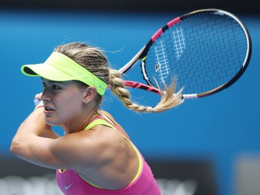 Eugenie Bouchard of Canada plays a backhand in her quarterfinal match against Maria Sharapova of Russia during day nine of the 2015 Australian Open at Melbourne Park on January 27, 2015 in Melbourne, Australia.