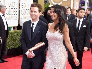 Actors Kevin Connolly (L) and Emmanuelle Chriqui attend the 72nd Annual Golden Globe Awards at The Beverly Hilton Hotel on January 11, 2015 in Beverly Hills, California.