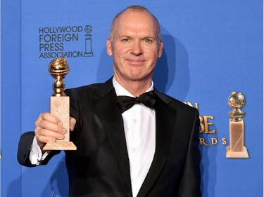 Actor Michael Keaton, winner of Best Actor in a Motion Picture - Musical or Comedy for 'Birdman,' poses in the press room during the 72nd Annual Golden Globe Awards at The Beverly Hilton Hotel on January 11, 2015 in Beverly Hills, California.