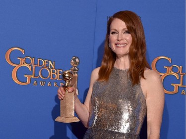 Actress Julianne Moore, winner of Best Actress in a Motion Picture - Drama for 'Still Alice,' poses in the press room during the 72nd Annual Golden Globe Awards at The Beverly Hilton Hotel on January 11, 2015 in Beverly Hills, California.