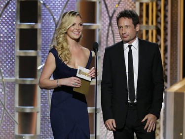 In this image released by NBC,  Katherine Heigl, left, and David Duchovny present an award at the 72nd Annual Golden Globe Awards on Sunday, Jan. 11, 2015, at the Beverly Hilton Hotel in Beverly Hills, Calif.