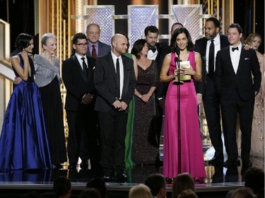 In this image released by NBC, Sarah Treem, foreground, accepts the award for best TV drama series for "The Affair"at the 72nd Annual Golden Globe Awards on Sunday, Jan. 11, 2015, at the Beverly Hilton Hotel in Beverly Hills, Calif.