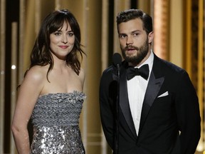 Fifty Shades of Grey stars Dakota Johnson and Jamie Dornan speak onstage during the 72nd Annual Golden Globe Awards at The Beverly Hilton Hotel on January 11, 2015 in Beverly Hills, California.