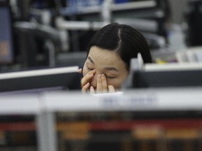 A currency trader at the Korea Exchange Bank headquarters in Seoul, South Korea, Jan. 6, 2015.