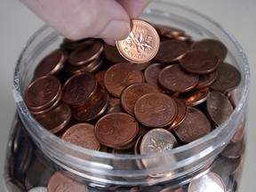 A household penny jar is shown in Montreal, Monday, February 4, 2013. When it comes to balancing the country's books, dormant bank accounts are equivalent to finding loose change under a couch cushion.THE CANADIAN PRESS/Ryan Remiorz ORG XMIT: CPT114