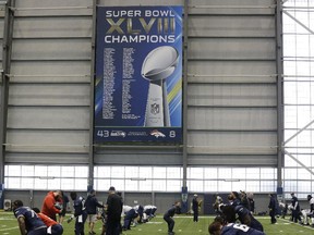 A Super Bowl XLVIII Champions banner hangs in the Seattle Seahawks indoor practice facility on Jan. 23, 2015, during practice in Renton, Wash.