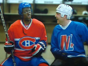 A twitter picture showing actor Marc St-Martin, left, with his face painted black, doing an impersonation of Montreal Canadiens' P.K. Subban, during Théatre du Rideau Vert year in review show 2014 Revue et Corrigée. The play has been denounced by Montreal artists.