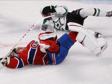 Alex Goligoski of the Dallas Stars collides with Carey Price of the Montreal Canadiens  in the third period of an NHL game at the Bell Centre in Montreal Tuesday, January 27, 2015. Goligoski received a tripping penalty.