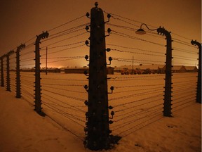 A barbed wire fence surrounds the former Auschwitz-Birkenau concentration camp on the night prior to commemoration events marking the 70th anniversary of the liberation of the camp on January 26, 2015 in Oswiecim, Poland. International heads of state, dignitaries and over 300 Auschwitz survivors will commemorate the 70th anniversary of the liberation of Auschwitz by Soviet troops in 1945 on January 27. Auschwitz was among the most notorious of the concentration camps run by the Nazis to enslave and kill millions of Jews, political opponents, prisoners of war, homosexuals and Roma.