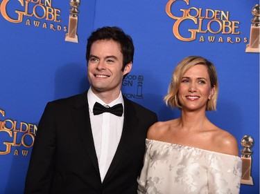 Bill Hader, left, and Kristen Wiig pose in the press room at the 72nd annual Golden Globe Awards at the Beverly Hilton Hotel on Sunday, Jan. 11, 2015, in Beverly Hills, Calif.