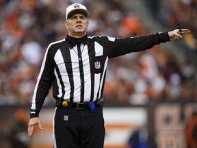 In this Dec. 16, 2012, file photo, NFL referee Bill Vinovich makes a call during game between the Cleveland Browns and Washington Redskins in Cleveland.