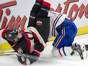 Montreal Canadiens defenseman Andrei Markov trips up Ottawa Senators right wing Bobby Ryan during third-period action Thursday, Jan. 15, 2015, in Ottawa.