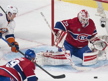 Montreal Canadiens goaltender Dustin Tokarski makes a save on New York Islanders' Brock Nelson as Andrei Markov defends during third period at the Bell Centre on Saturday, Jan. 17.