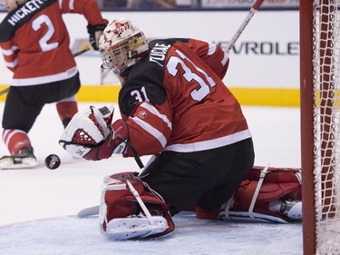Canada's Zachary Fucale deflects a Russian shot during gold medal game hockey action at the IIHF World Junior Championship in Toronto on Monday, Jan. 5, 2015.