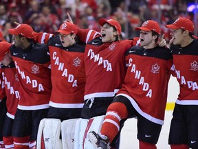 Canadian players celebrate Canada's 5-4 win over Russia during the gold medal game hockey action at the IIHF World Junior Championship in Toronto on Monday, Jan. 5, 2015.