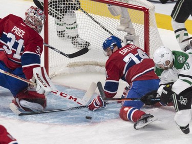 Montreal Canadiens defenceman Alexei Emelin stops a shot by Dallas Stars' Patrick Eaves behind Canadiens goalie Carey Price during first period NHL hockey action Tuesday, January 27, 2015 in Montreal.