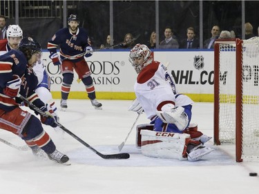 Montreal Canadiens goalie Carey Price (31) defends the net against a shot on goal by New York Rangers right wing Mats Zuccarello (36) during the second period of an NHL hockey game Thursday, Jan. 29, 2015 at Madison Square Garden in New York.