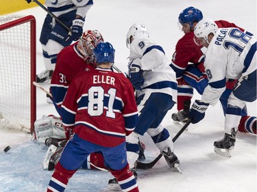 Tampa Bay Lightning's Tyler Johnson, right, scores past Montreal Canadiens goalie Carey Price during second period NHL hockey action Tuesday, January 6, 2015 in Montreal.