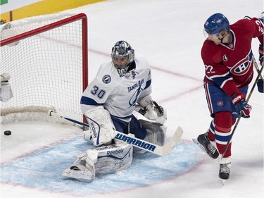 Dale Weise scores past Tampa Bay Lightning goalie Ben Bishop during first period NHL hockey action Tuesday, January 6, 2015 in Montreal.