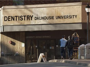 Students head to the Dalhousie University dentistry building in Halifax on Tuesday, Jan.6, 2015. There are renewed calls for the expulsion of more than a dozen male dentistry students at the school after they allegedly posted misogynistic comments about their female colleagues on Facebook.