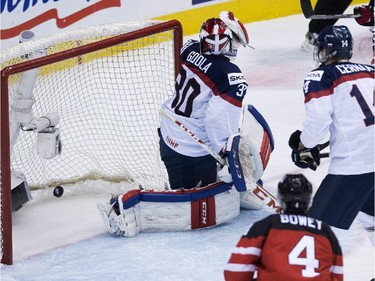Canada scores past Slovakia goalie Denis Godla (30) during first period semifinal hockey action at the IIHF World Junior Championships in Toronto on Sunday, January 4, 2015.