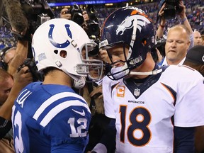 Andrew Luck of the Indianapolis Colts (left) and Peyton Manning of the Denver Broncos meet after game at Lucas Oil Stadium on Oct. 20, 2013 in Indianapolis.
