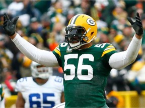 Julius Peppers of the Green Bay Packers reacts after a play during playoff game against the Dallas Cowboys at Lambeau Field on Jan. 11, 2015 in Green Bay, Wisc.