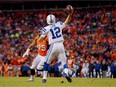 Indianapolis Colts QB Andrew Luck passes against the Denver Broncos  during NFL playoff game in Denver on Jan. 11, 2015.