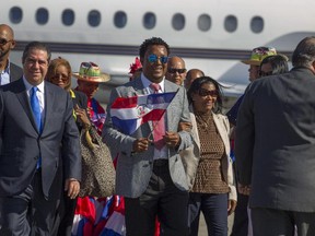 Baseball Hall of Fame inductee Pedro Martinez is greeted after getting off plane at the Las Americas International Airport in Santo Domingo on Jan. 10, 2015.