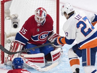 Montreal Canadiens goaltender Dustin Tokarski makes a save on New York Islanders' Anders Lee during second period at the Bell Centre on Saturday, Jan. 17.