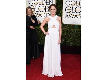 Emily Blunt poses in a Michael Kors gown at the 72nd annual Golden Globe Awards at the Beverly Hilton Hotel on Sunday, Jan. 11, 2015, in Beverly Hills, Calif.