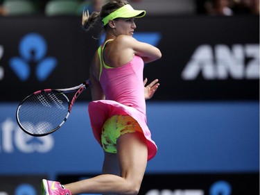 Eugenie Bouchard of Canada plays a shot to Maria Sharapova of Russia during their quarterfinal match at the Australian Open tennis championship in Melbourne, Australia, Tuesday, Jan. 27, 2015.