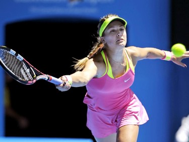 Eugenie Bouchard of Canada reaches for a shot to Caroline Garcia of France during their third round match at the Australian Open tennis championship in Melbourne, Australia, Friday, Jan. 23, 2015.