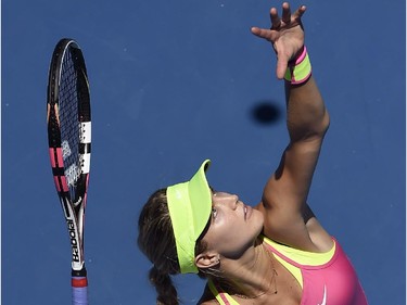 Eugenie Bouchard of Canada serves to Caroline Garcia of France  during their third round match at the Australian Open tennis championship in Melbourne, Australia, Friday, Jan. 23, 2015.
