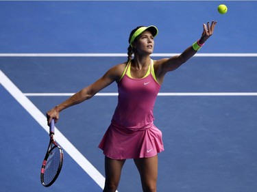 Eugenie Bouchard of Canada serves to Maria Sharapova of Russia during their quarterfinal match at the Australian Open tennis championship in Melbourne, Australia, Tuesday, Jan. 27, 2015.