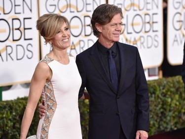 Felicity Huffman, left, and William H. Macy arrive at the 72nd annual Golden Globe Awards at the Beverly Hilton Hotel on Sunday, Jan. 11, 2015, in Beverly Hills, Calif.