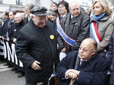 Nazi Hunter Serge Klarsfeld (L) and the Rector of Paris' Mosque Dalil Boubakeur take part in a Unity rally Marche Republicaine in Paris on January 11, 2015 in tribute to the 17 victims of a three-day killing spree by homegrown Islamists. The killings began on January 7 with an assault on the Charlie Hebdo satirical magazine in Paris that saw two brothers massacre 12 people including some of the country's best-known cartoonists, the killing of a policewoman and the storming of a Jewish supermarket on the eastern fringes of the capital which killed 4 local residents.