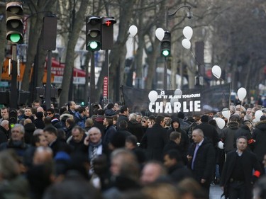 People take part in a Unity rally Marche Republicaine in Paris on January 11, 2015 in tribute to the 17 victims of a three-day killing spree by homegrown Islamists. The killings began on January 7 with an assault on the Charlie Hebdo satirical magazine in Paris that saw two brothers massacre 12 people including some of the country's best-known cartoonists, the killing of a policewoman and the storming of a Jewish supermarket on the eastern fringes of the capital which killed 4 local residents.