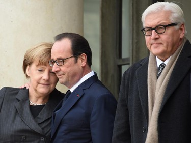 French President Francois Hollande (C) welcomes German Vice Chancellor (L) and German Foreign Minister Frank-Walter Steinmeier (R) at the Elysee Palace before attending a Unity rally Marche Republicaine on January 11, 2015 in Paris in tribute to the 17 victims of a three-day killing spree by homegrown Islamists. The killings began on January 7 with an assault on the Charlie Hebdo satirical magazine in Paris that saw two brothers massacre 12 people including some of the country's best-known cartoonists, the killing of a policewoman and the storming of a Jewish supermarket on the eastern fringes of the capital which killed 4 local residents.